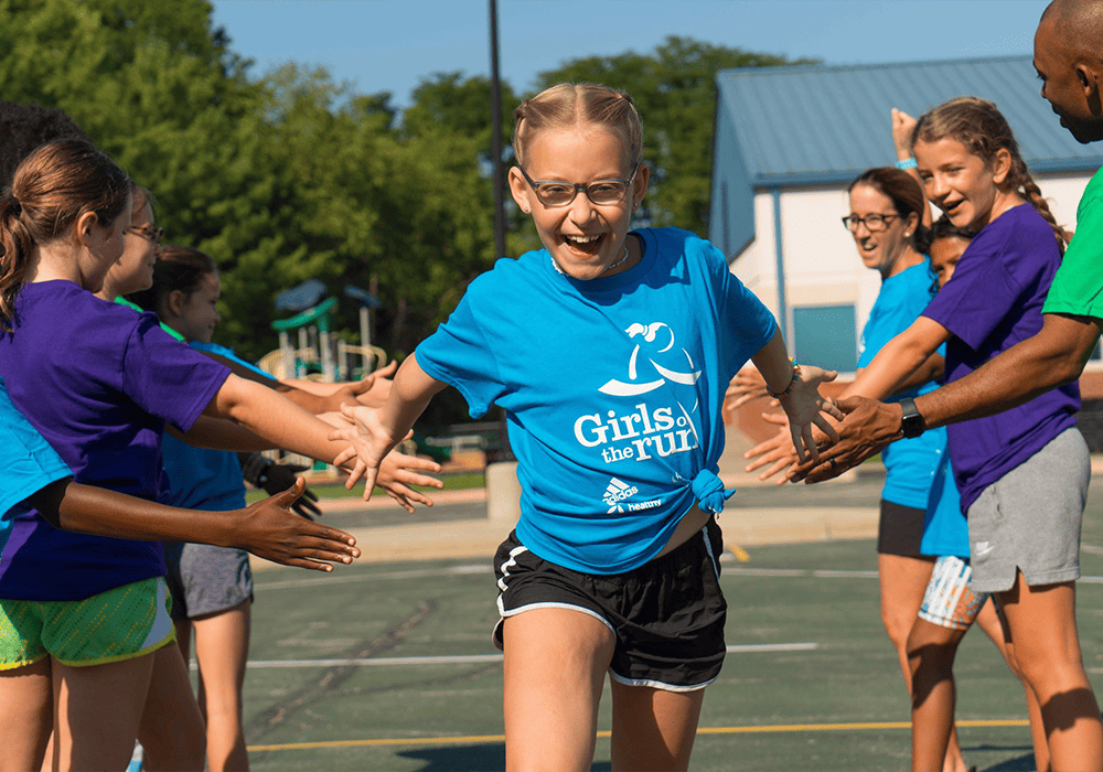 Girl running and celebrating.